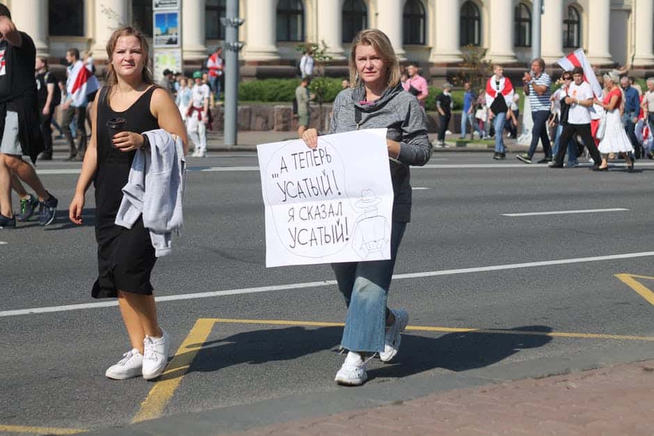 Women with Sign Protesting on the Street of City in Belarus 