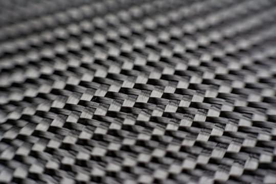 composite product dark carbon fiber macro zoom close up
