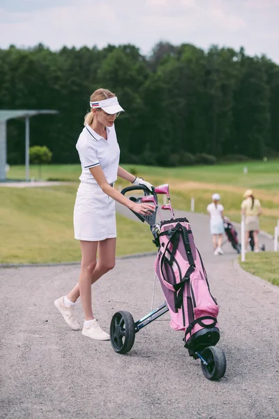 Selective Focus Female Golf Player Cap White Polo Golf Gear Stock Picture