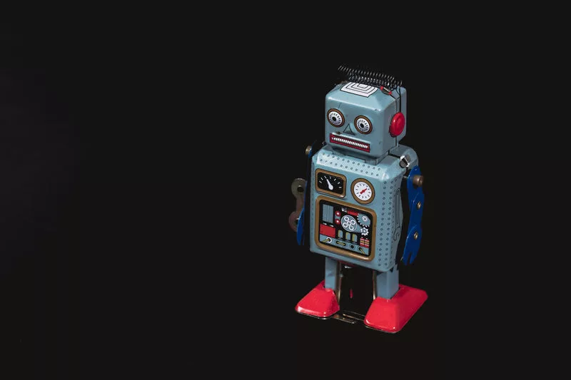 vintage robot with lots of black negative space