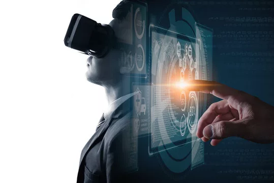 The double exposure image of the businessman wearing VR glasses overlay with virtual hologram image