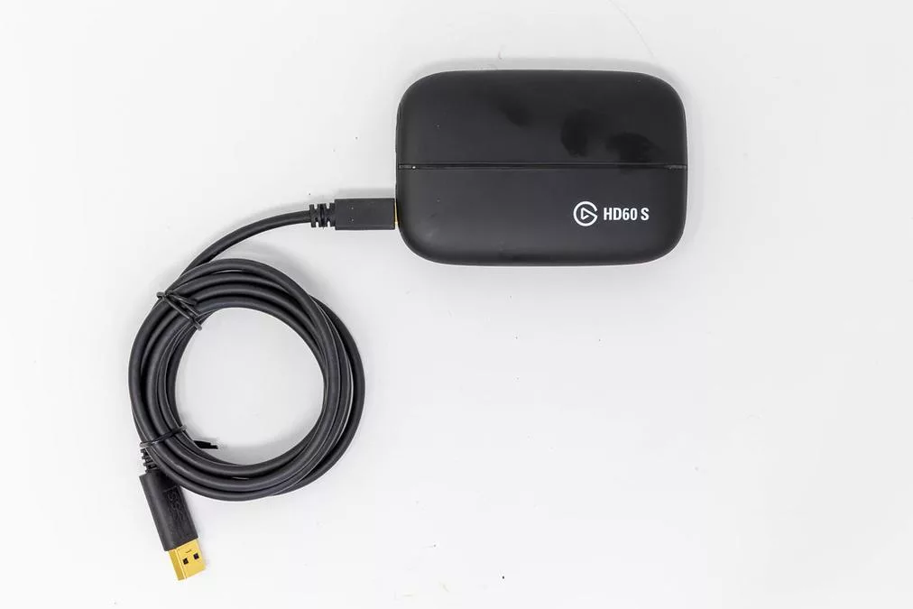 Elgato HD60 S game capture device for recording and live streaming, photo from above on a white back