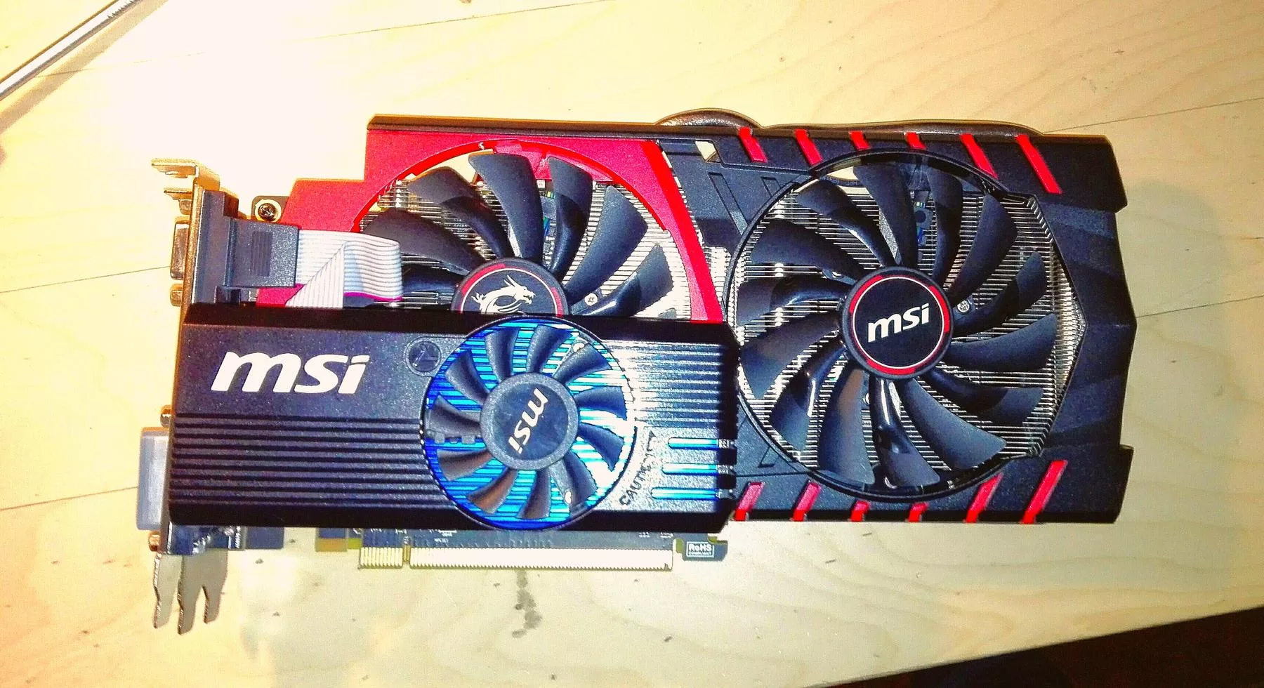 File:Compare of old and new graphic card MSI.jpg - a computer processor with a fan and a cooling pad