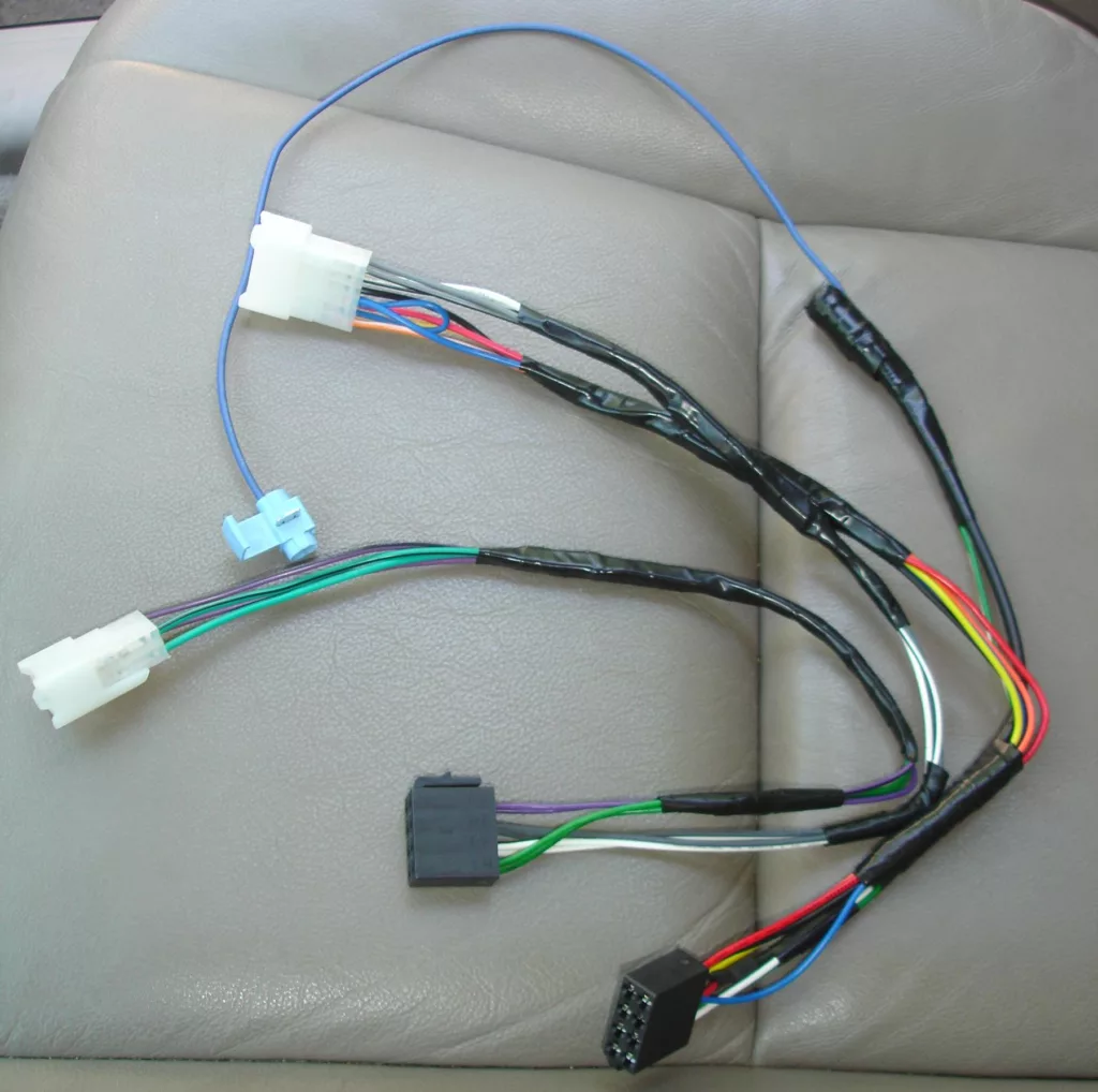 File:Wire harness for aftermarket head unit.jpeg - a car seat with a wiring harness and wires