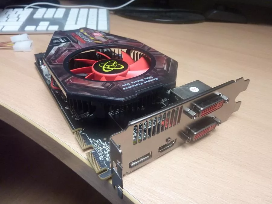 Graphics Card - the graphics card is sitting on top of a desk