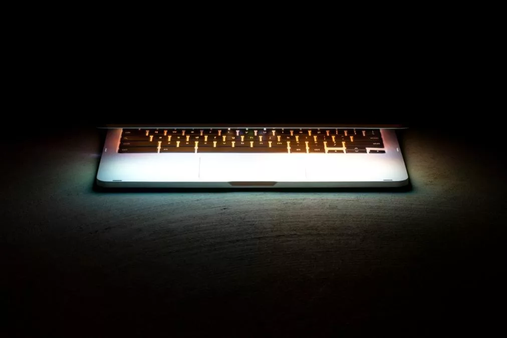 Laptop Keyboard - a laptop computer lit up with a light