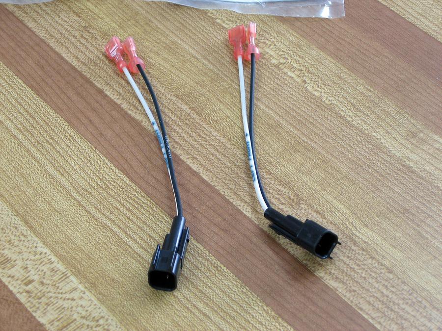 Mazda / Ford Speaker Wire Adapters - a pair of scissors laying on a wooden floor
