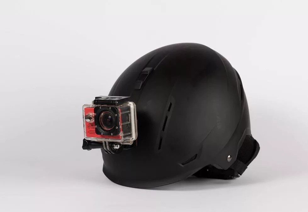 Protection helmet with mounted action camera - a helmet with a gopro camera attached to it