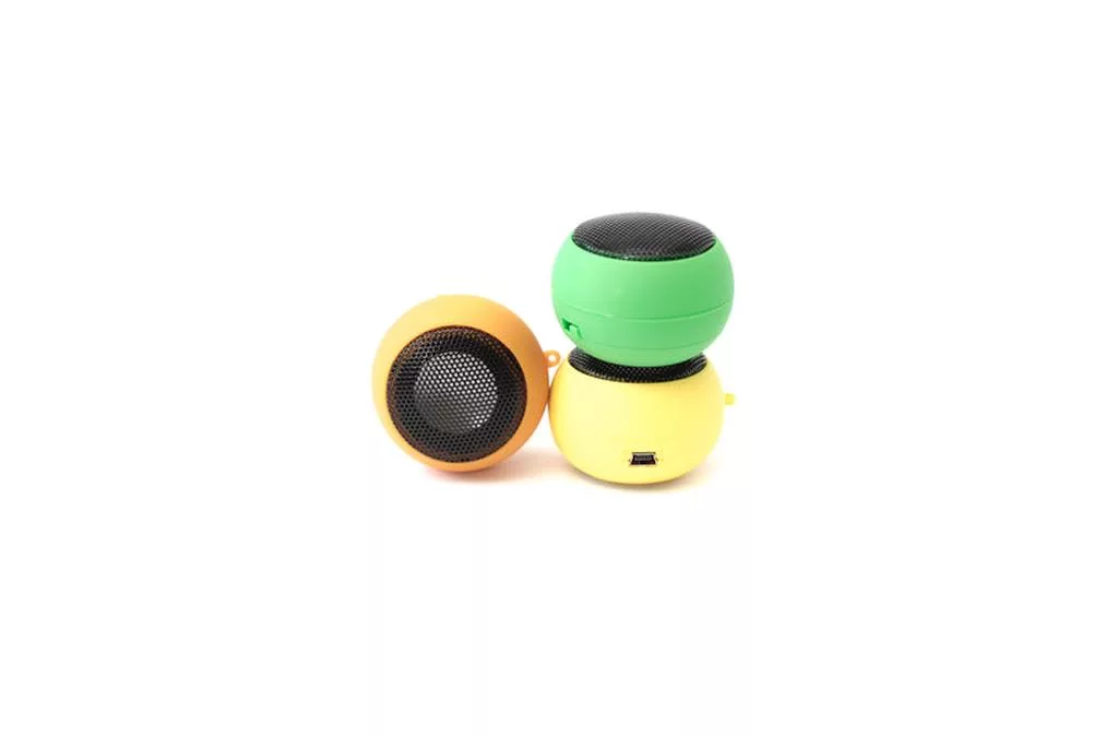 mini plugin speakers - a pair of yellow and green plastic speakers
